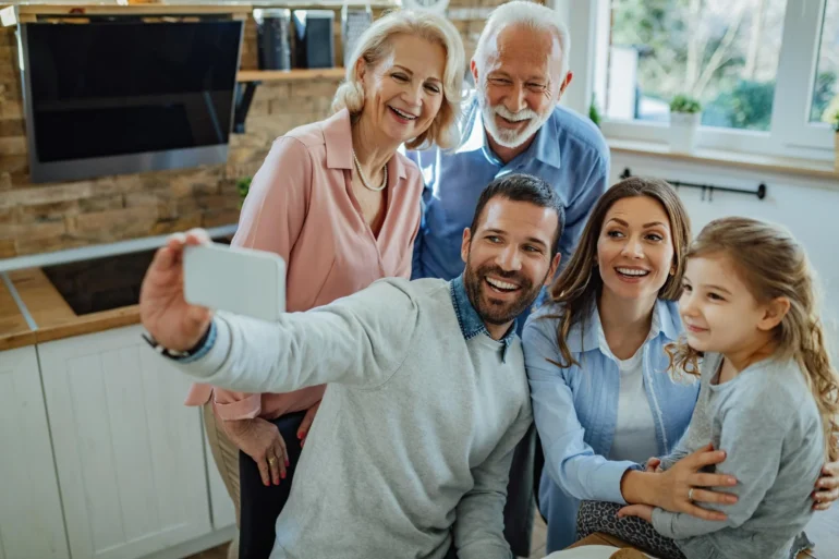 photo of a happy 3-generation family taking selfie
